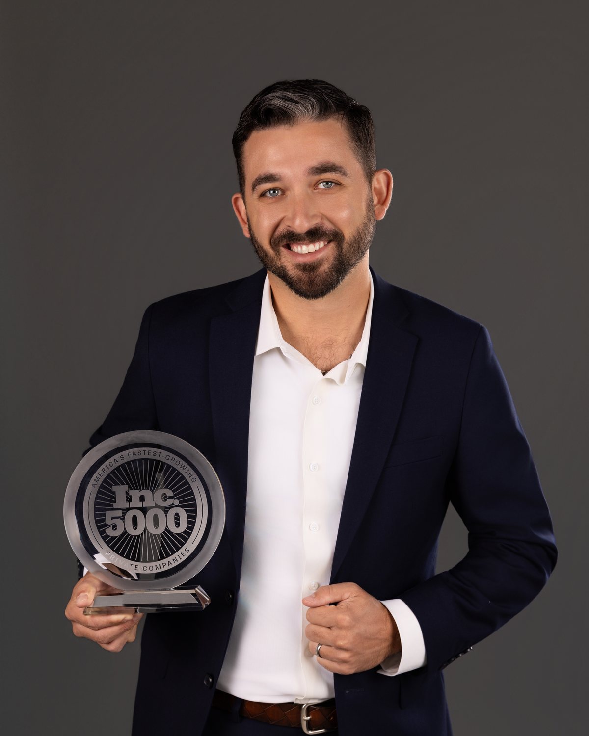 Joe Amara holding the 2025 Inc. 5000 award